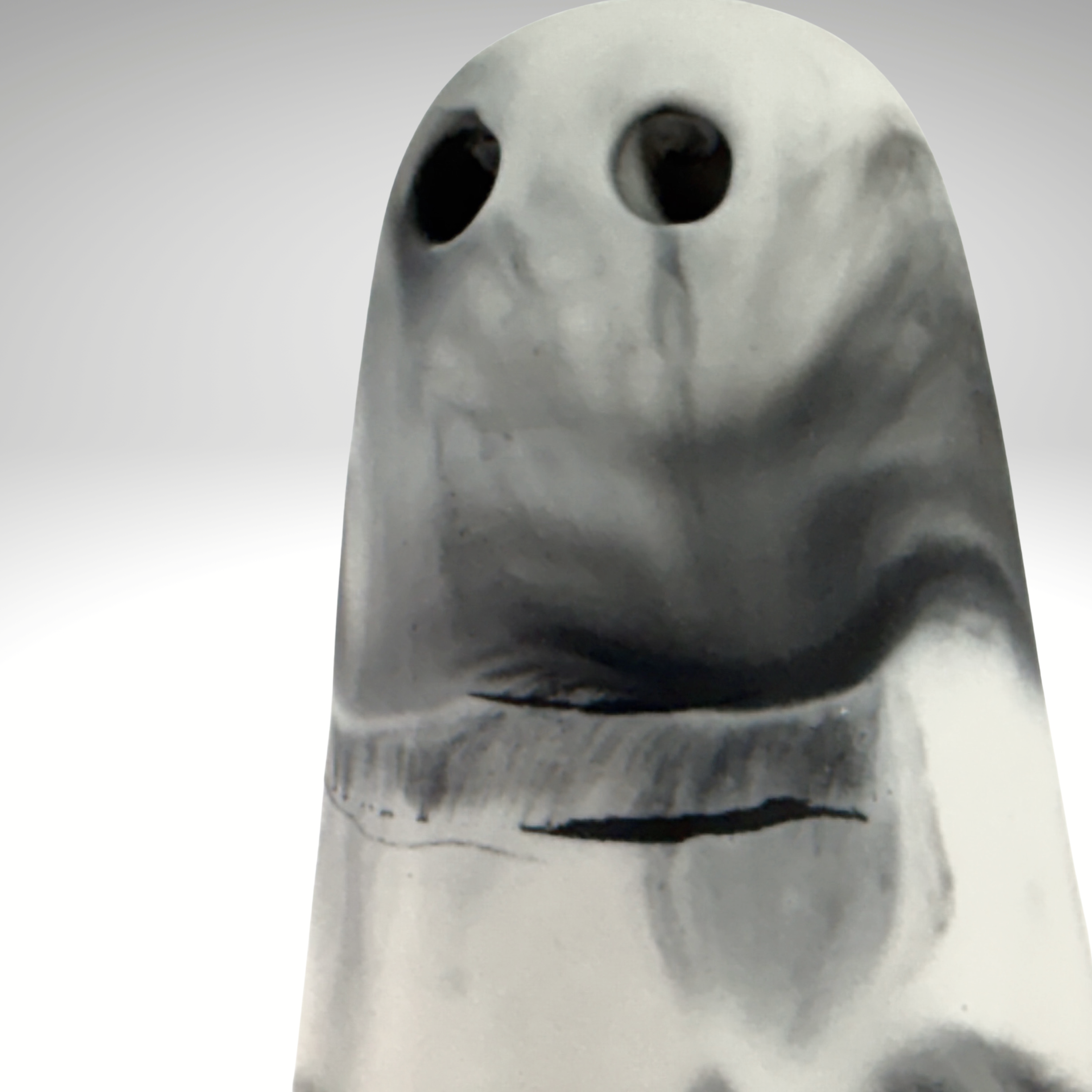 A black and white marbled ghost figurine by The Nordic Ghost Merchants