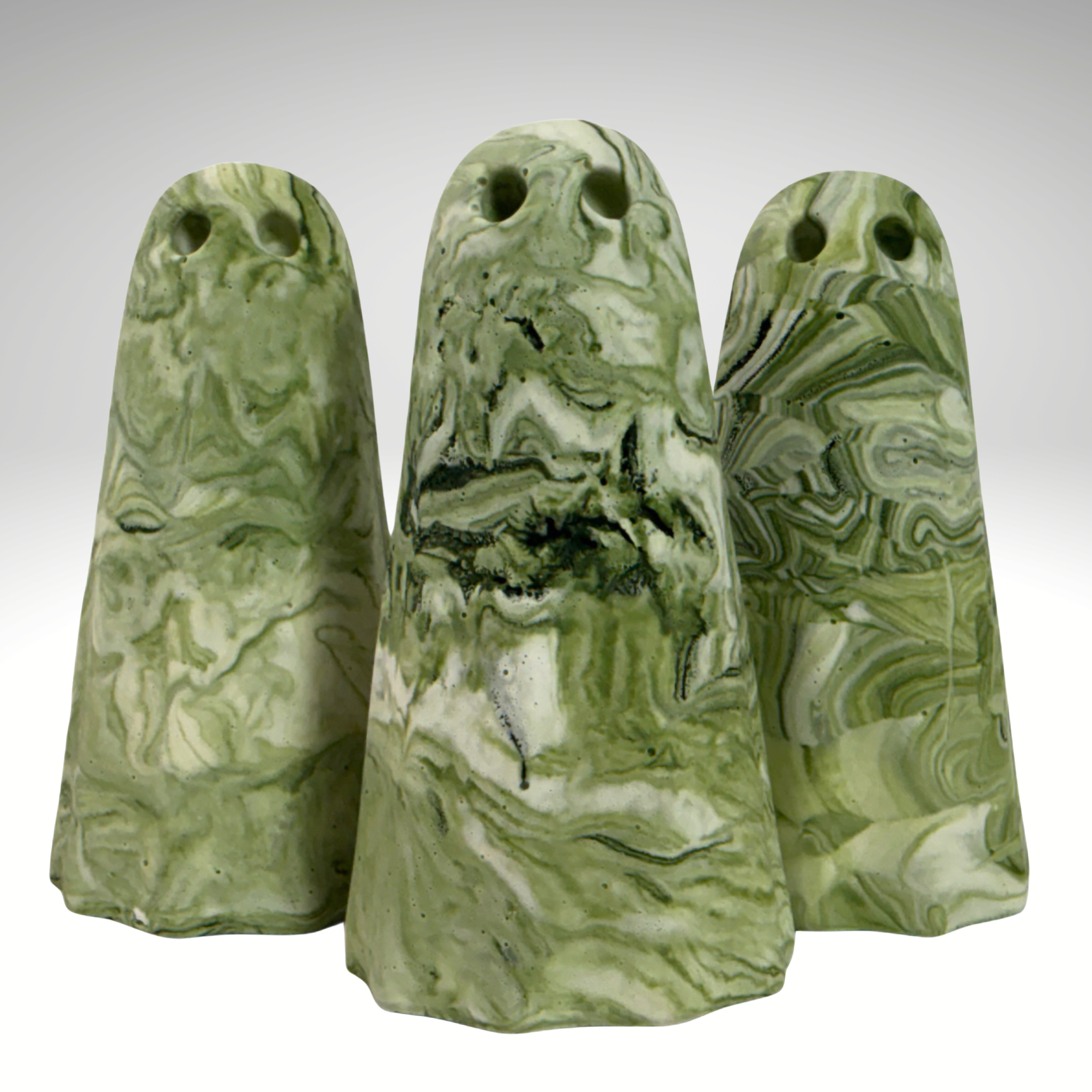 Green and white marbled ghost figurines by The Nordic Ghost Merchants