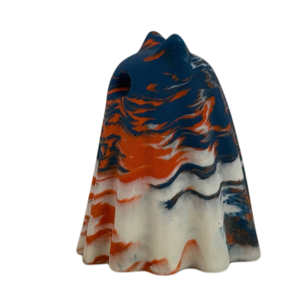 Crispin Windfall Familiar figurine, side view showing a deep blue crown with burnt orange and cream marbling flowing through the body.