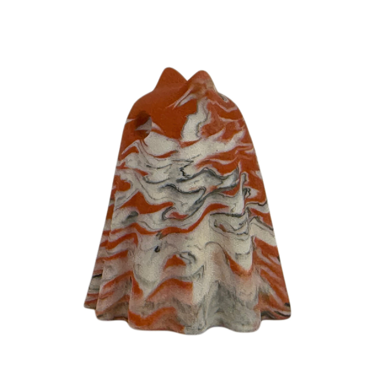 Æble Windfall ghost cat figurine, side view showing layered burnt orange and cream marbling with delicate charcoal veining.