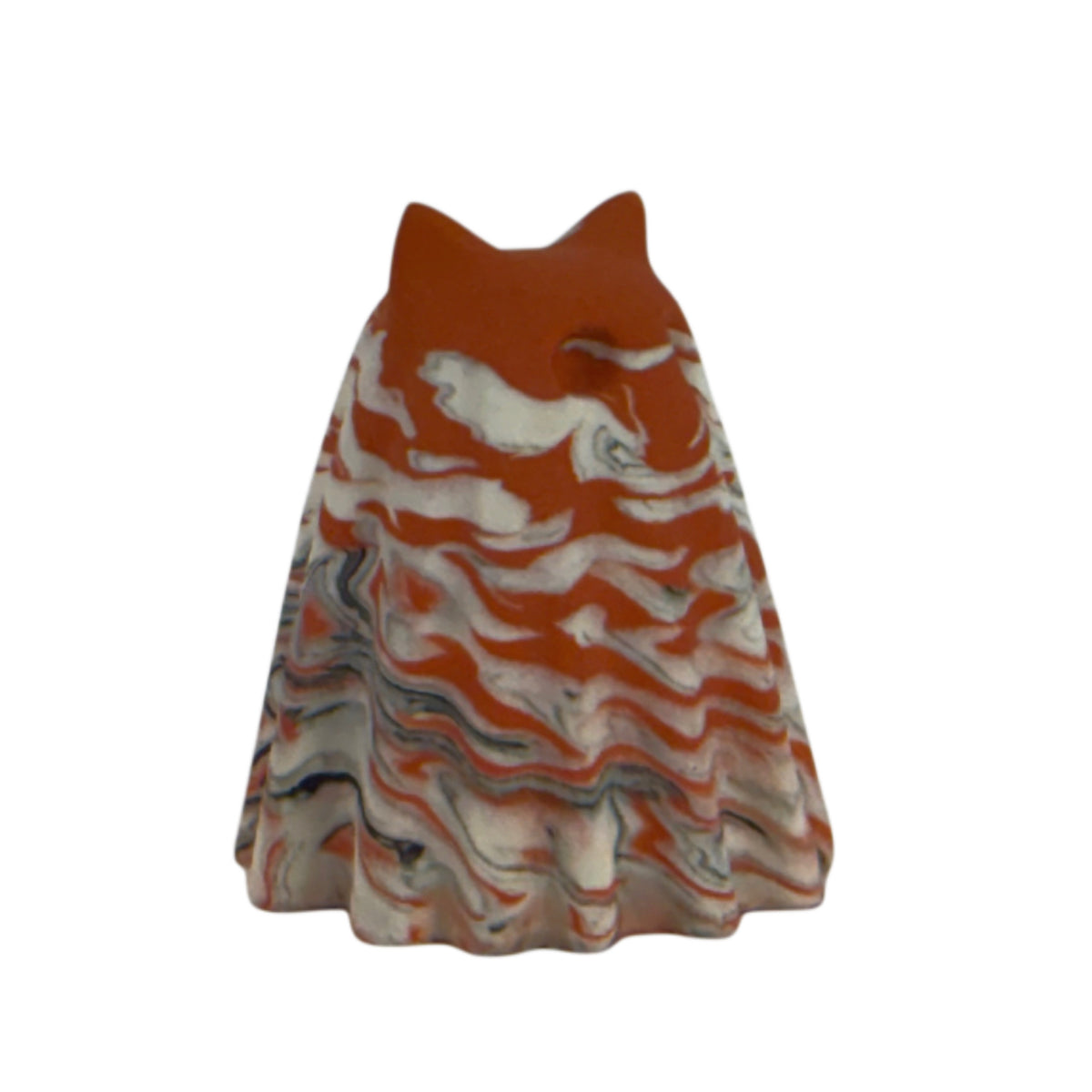 Æble Windfall ghost cat figurine, angled side view showing bold burnt orange marbling across the head and body with soft cream and charcoal swirls.