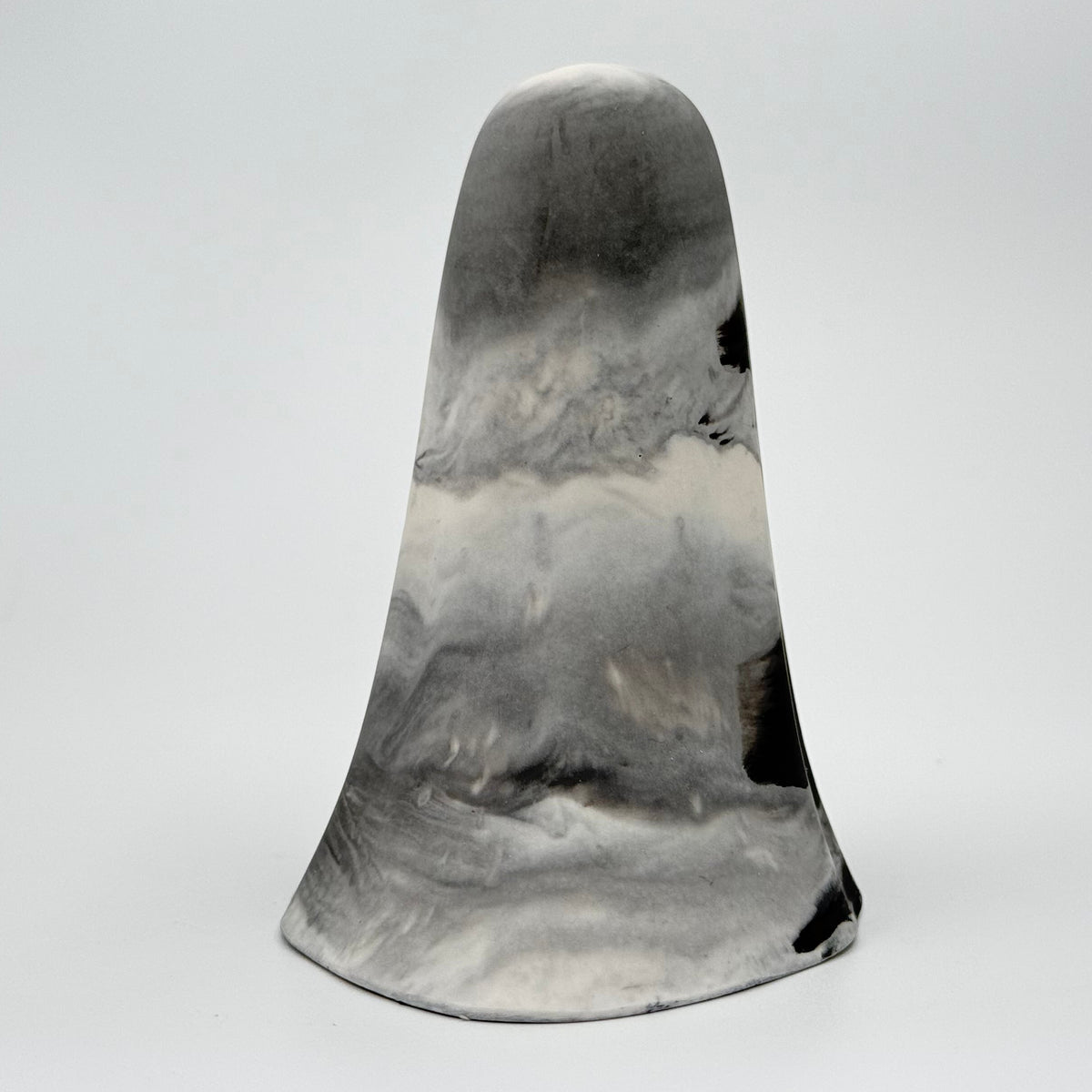 A grey and white smoky coloured ghost figurine made by The Nordic Ghost Merchants. Rear view