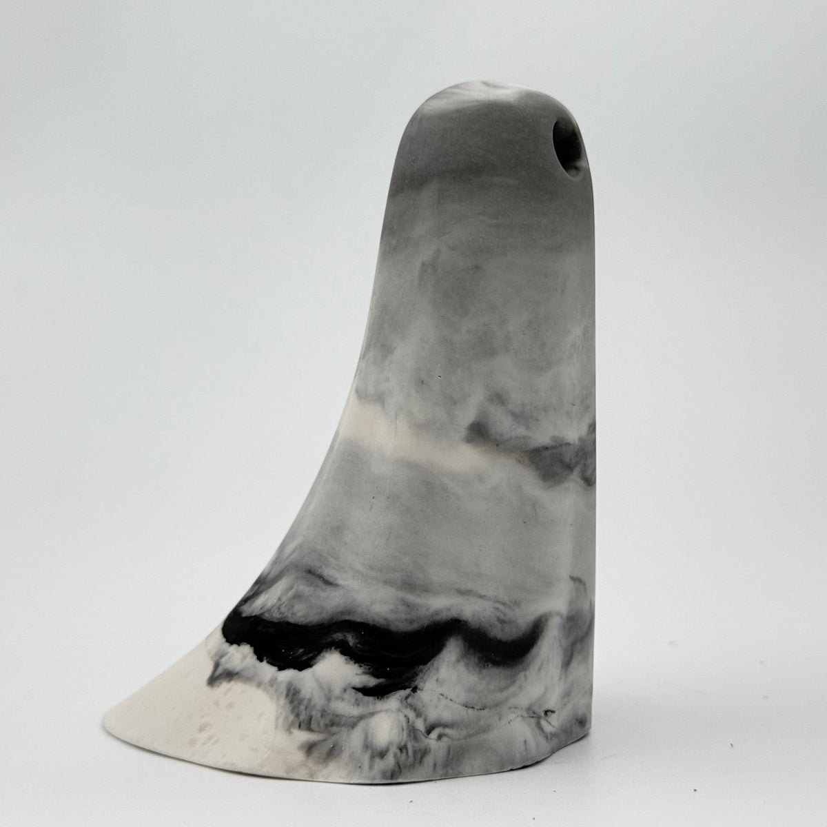A grey and white smoky handmade ghost figurine by The Nordic Ghost Merchants. Sideview