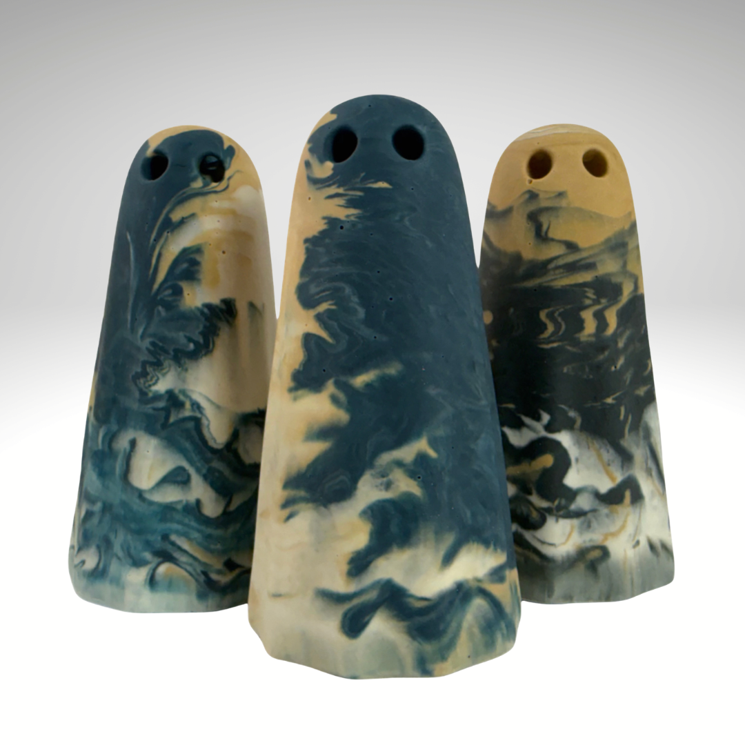 Handmade collectable ghost figurines in teal, white and sand marbled colours, made by The Nordic Ghost Merchants.