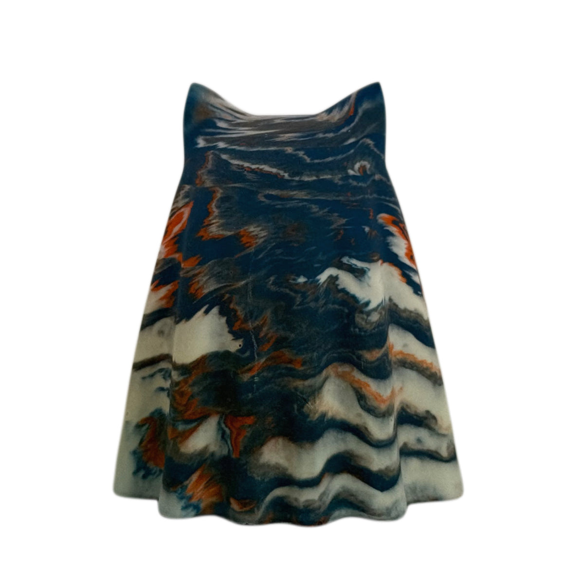 Crispin Windfall Familiar ghost figurine, rear angled view showing layered deep blue and burnt orange marbling over an old cream lower body.