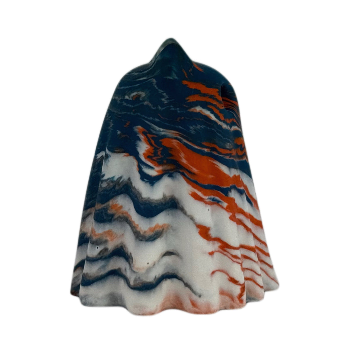 Crispin Windfall Familiar ghost figurine, side view showing a deep blue crown with burnt orange and cream marbling flowing through the body.