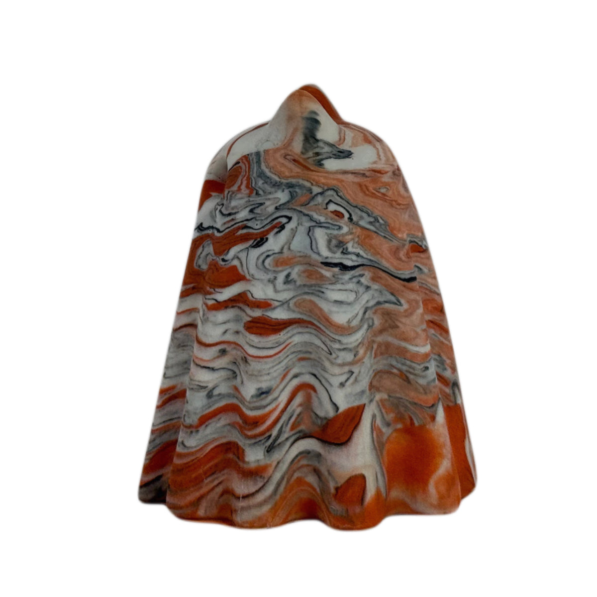Crumble Windfall ghost figurine,  side view showing layered orange and cream marbling with fine charcoal veining across the face and body.