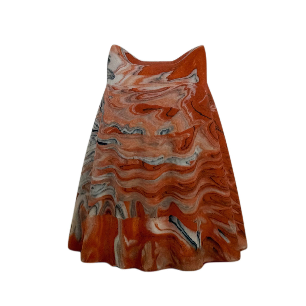 Crumble Windfall ghost figurine, angled rear view showing layered orange and cream marbling with fine charcoal veining across the face and body.