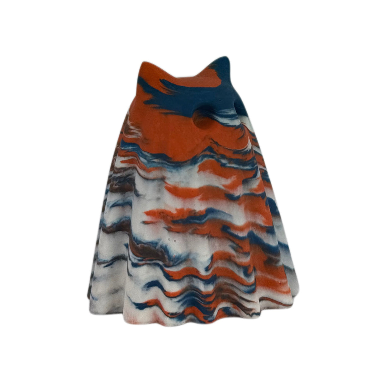 Fig Windfall Familiar ghost figurine, angled side view showing deep blue across the head with burnt orange and cream marbling flowing down the body.