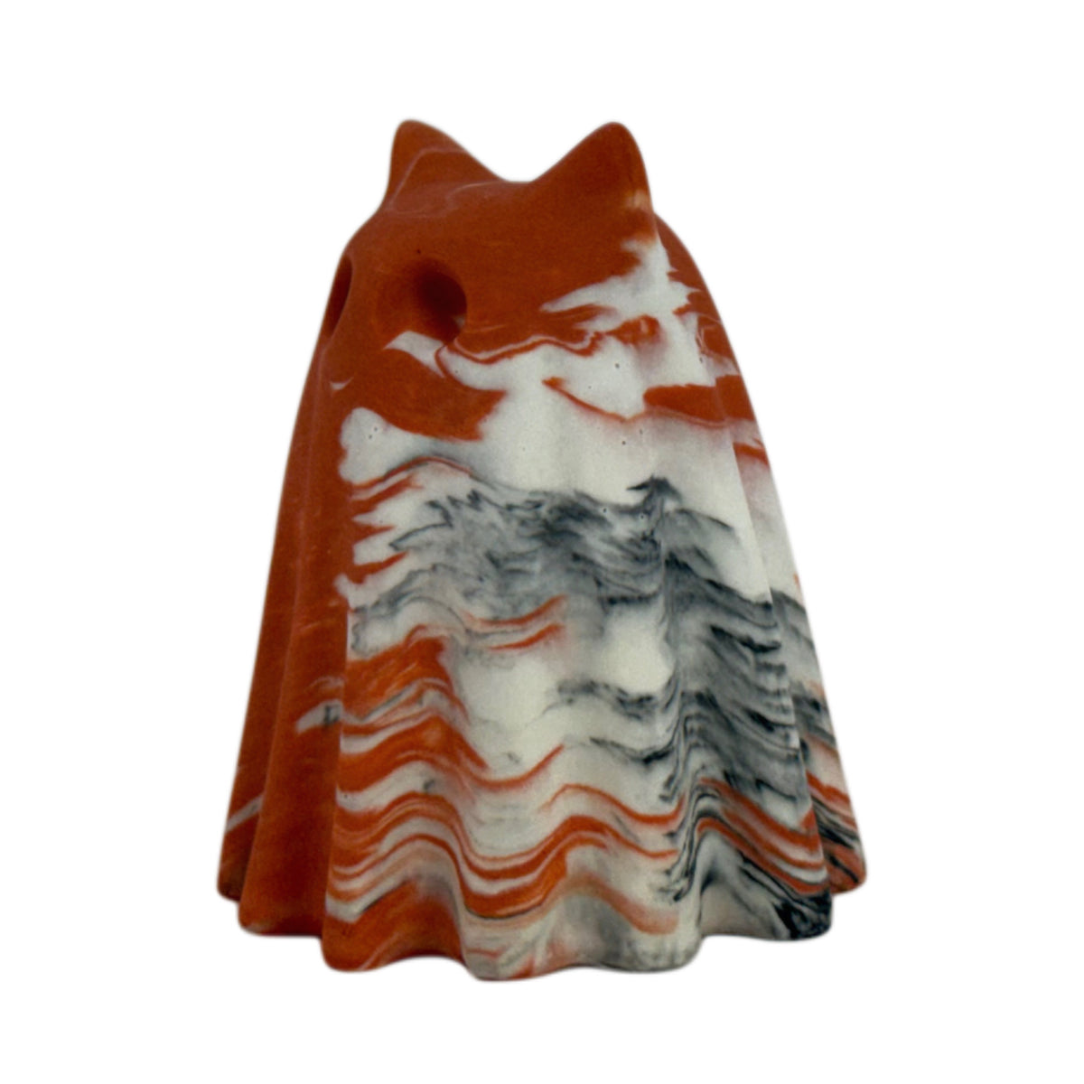 Porridge Windfall Familiar figurine, angled side view showing burnt orange and cream marbling with charcoal veining across the lower body.