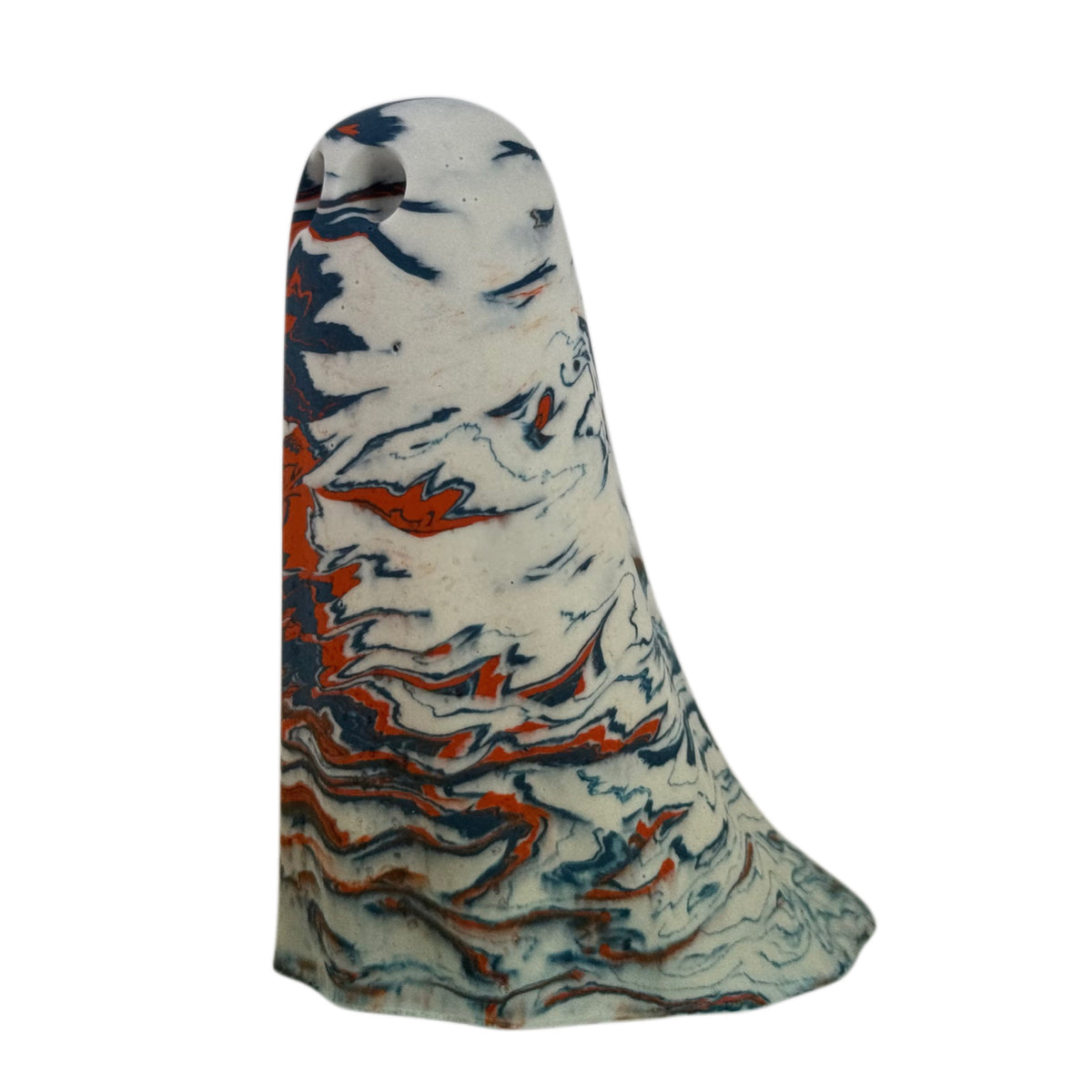 Halrik Windfall Ghost figurine, angled side view showing cream body with sweeping deep blue and burnt orange marbling across the upper half.
