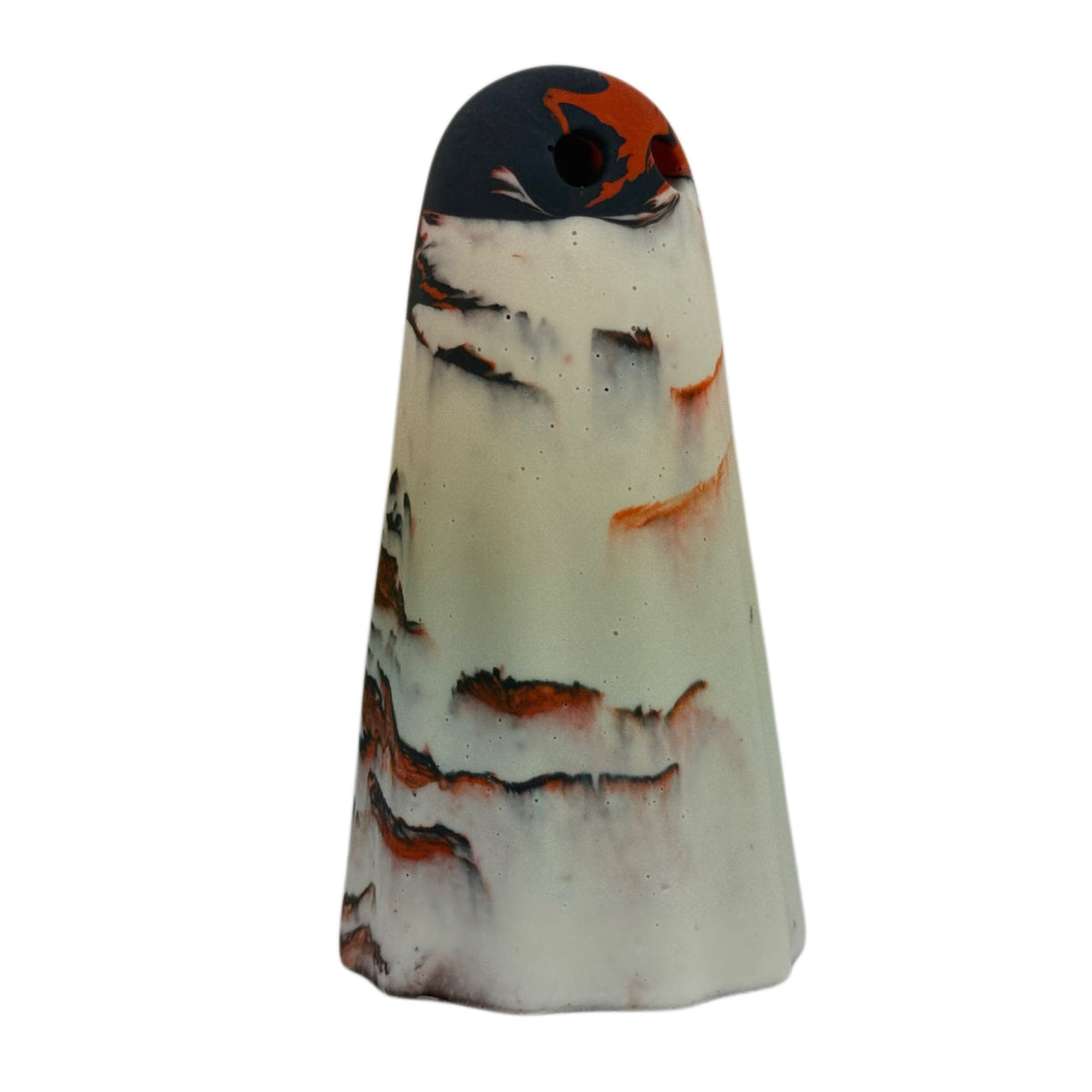 Ossrik Windfall Ghost figurine, angled side view showing a pale cream body with burnt orange and charcoal-black marbling concentrated around the crown.