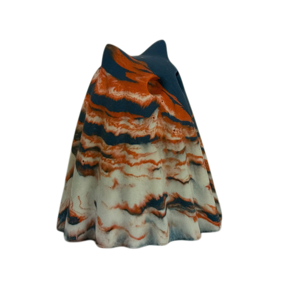 Cornelius Windfall ghost cat figurine, angled side view showing a dark navy crown with vivid burnt orange marbling across the body.