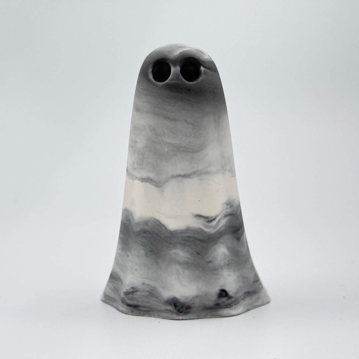 A grey and white marbled ghost figurine, handmade by The Nordic Ghost Merchants. Front view