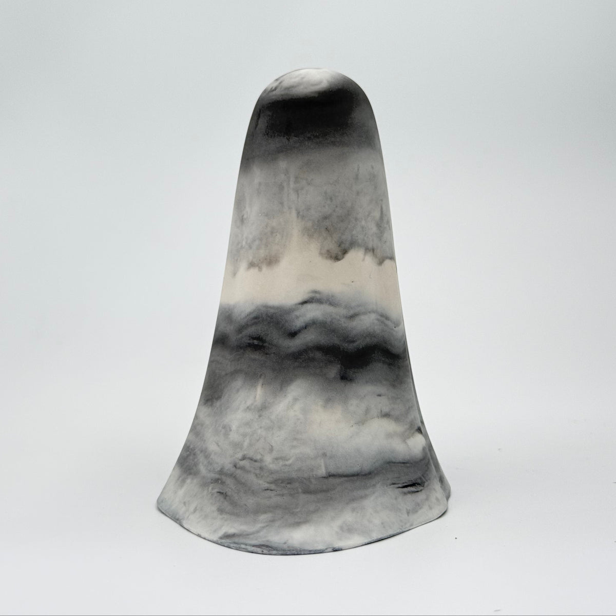 A grey and white marbled ghost figurine, handmade by The Nordic Ghost Merchants. Rear view