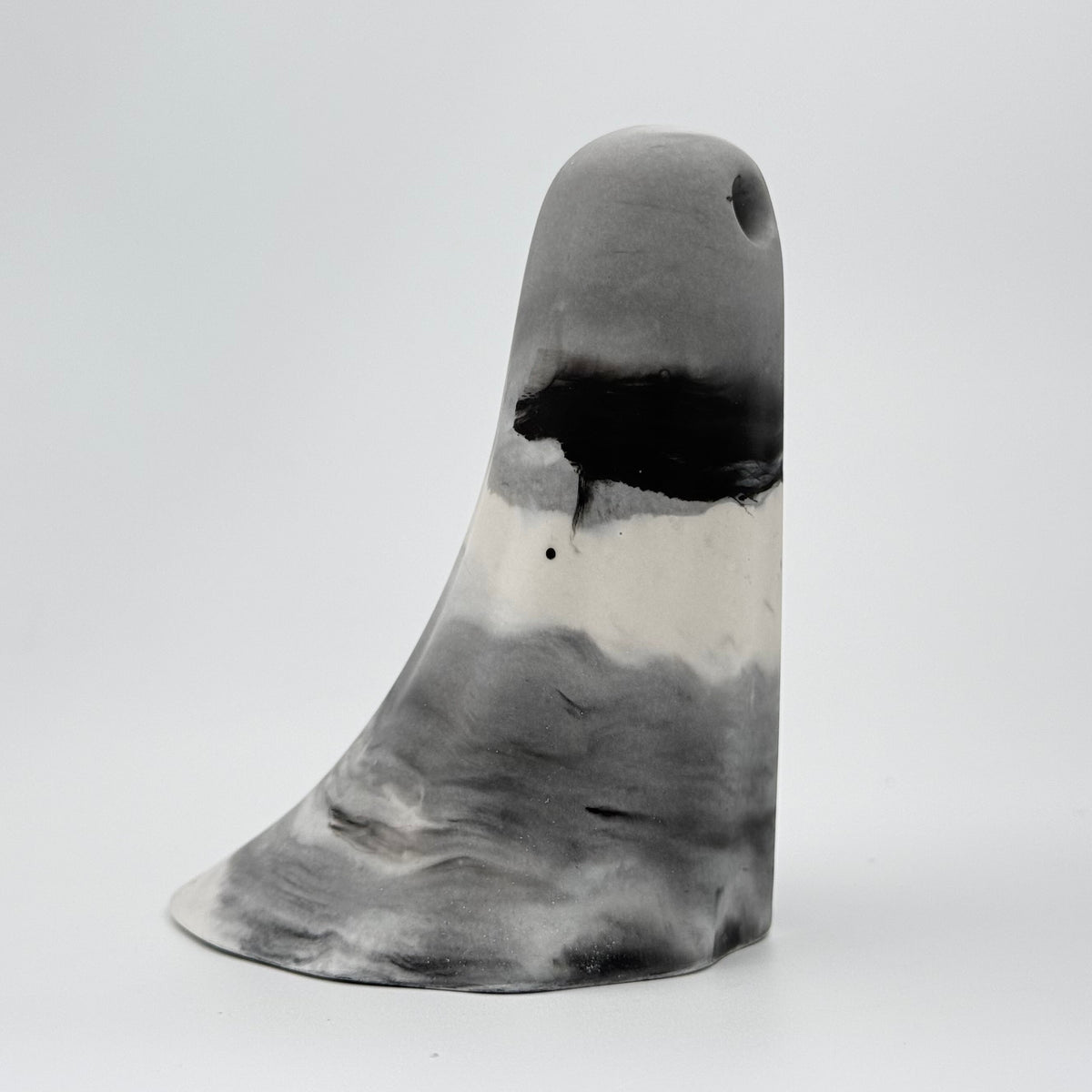 A grey and white smoky handmade ghost ornament by The Nordic Ghost Merchants. Side view