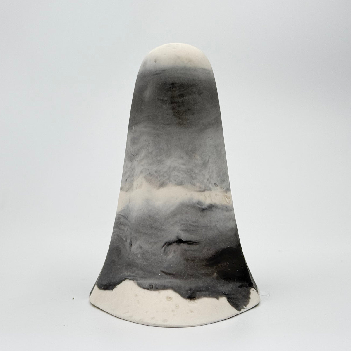 A grey and white smoky ghost figurine handmade by The Nordic Ghost Merchants. Rear view