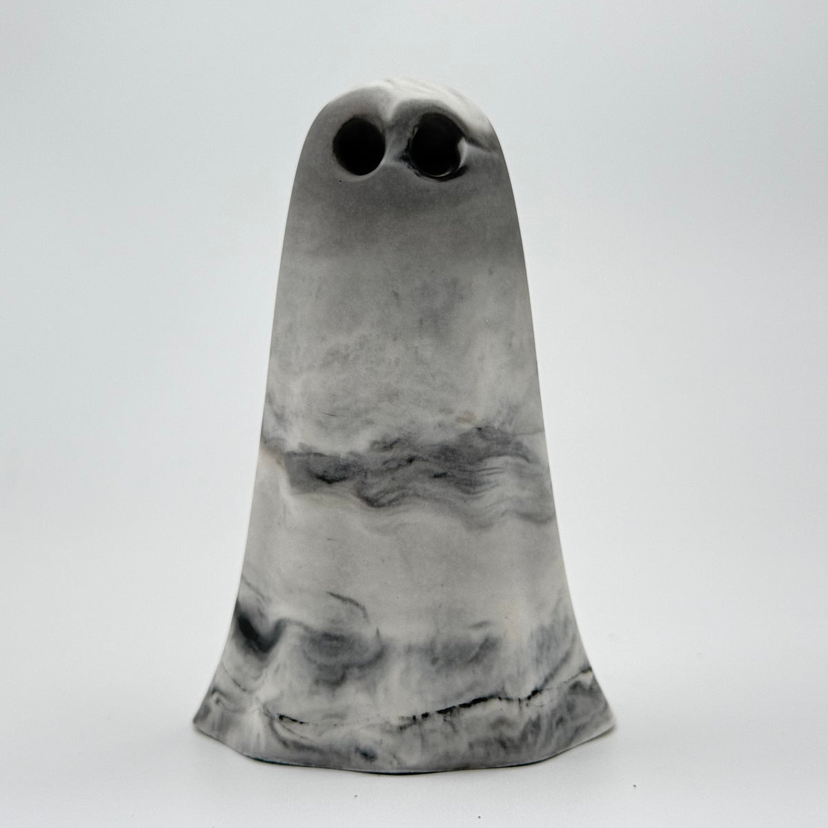 A grey and white smoky handmade ghost figurine by The Nordic Ghost Merchants. Front view
