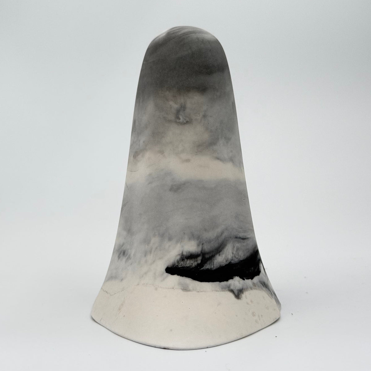 A grey and white smoky handmade ghost figurine by The Nordic Ghost Merchants. Rear view