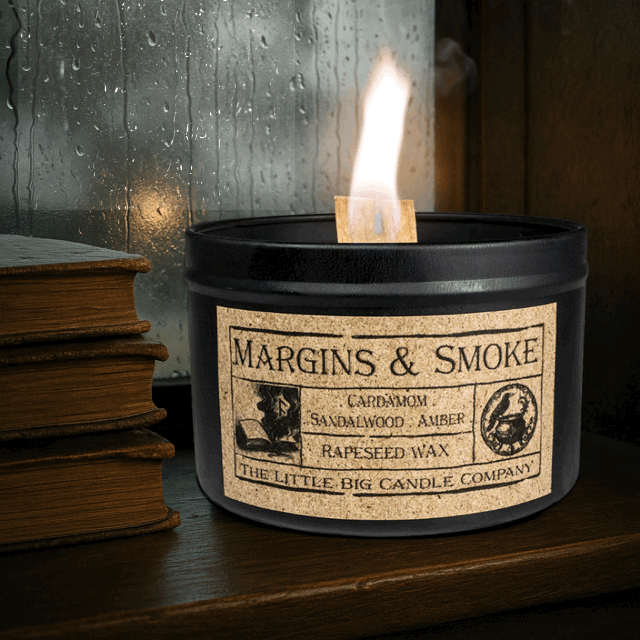 Margins & Smoke candle in black matte tin, rapeseed wax, cardamom and sandalwood fragrance, inspired by literary ritual and quiet libraries.
